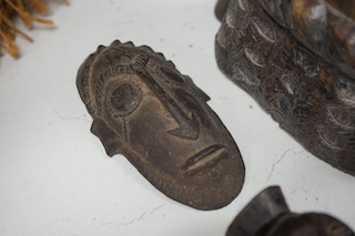 Two African tribal busts, two carved spoons and three carved Kamba Kenyan stools (11). Largest stool 28cm high. Condition - mostly good, some staining to seat of largest stool